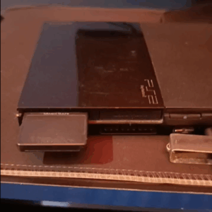 playstation 2 com memoricard e 2 controles.